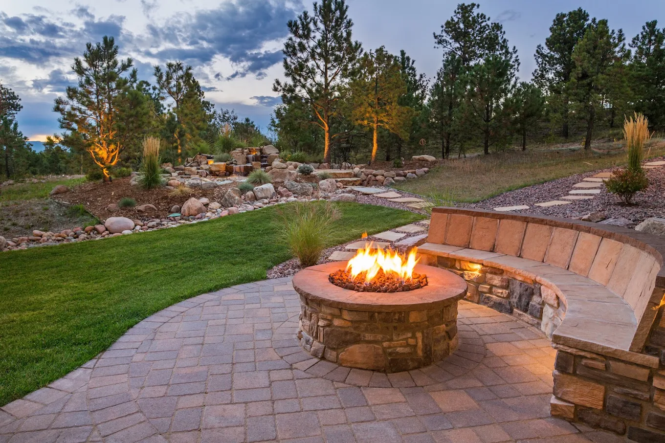 Completed stone fire feature and outdoor seating
